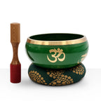 Large Tree of Life Singing Bowl Set- Green 14cm featuring a green singing bowl with gold Om symbols, a wooden striker, and a patterned cushion for meditation and sound healing.