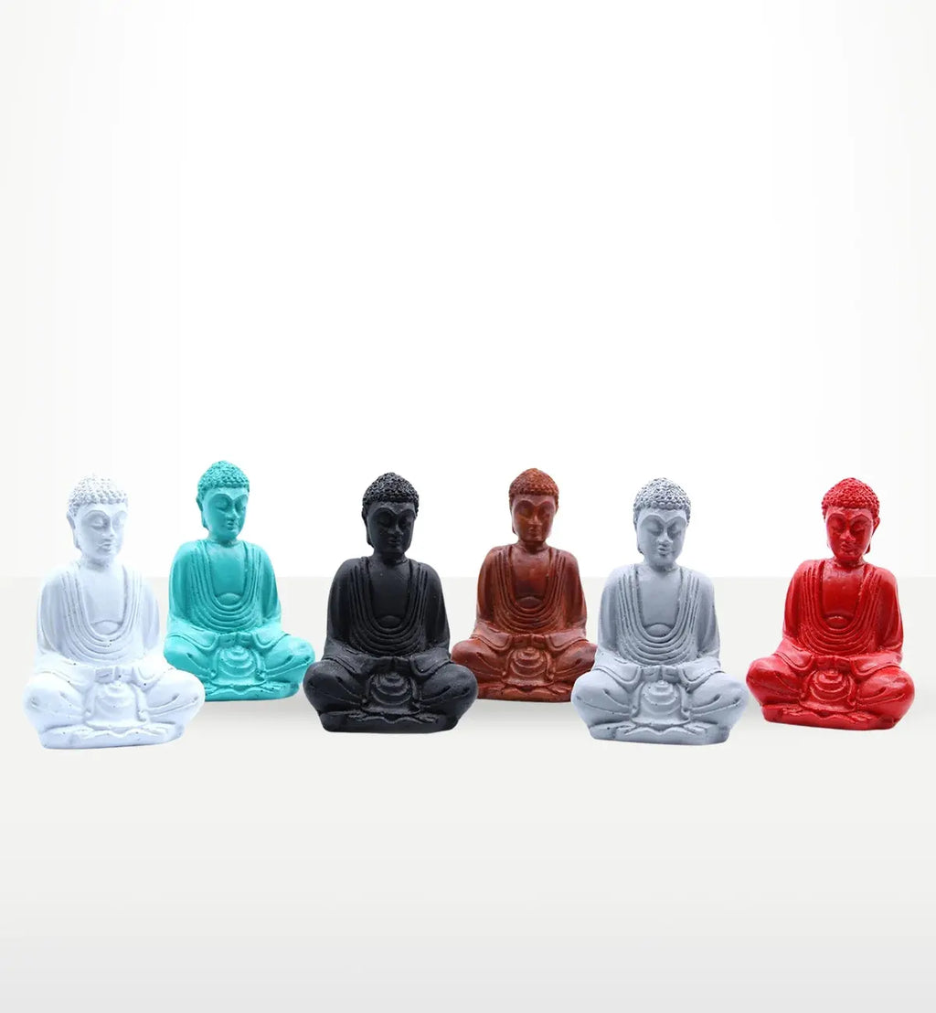A collection of six Matt Mini Buddha (Assorted Colours) statues in white, teal, black, brown, light grey, and red, displayed in a serene seated meditation pose.