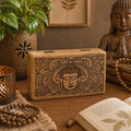 Med Square Box 17x10x4.2cm - Buddha Face Black Engraved wooden decorative box with intricate Buddha face design, placed on a wooden table alongside Buddha decor and natural elements.