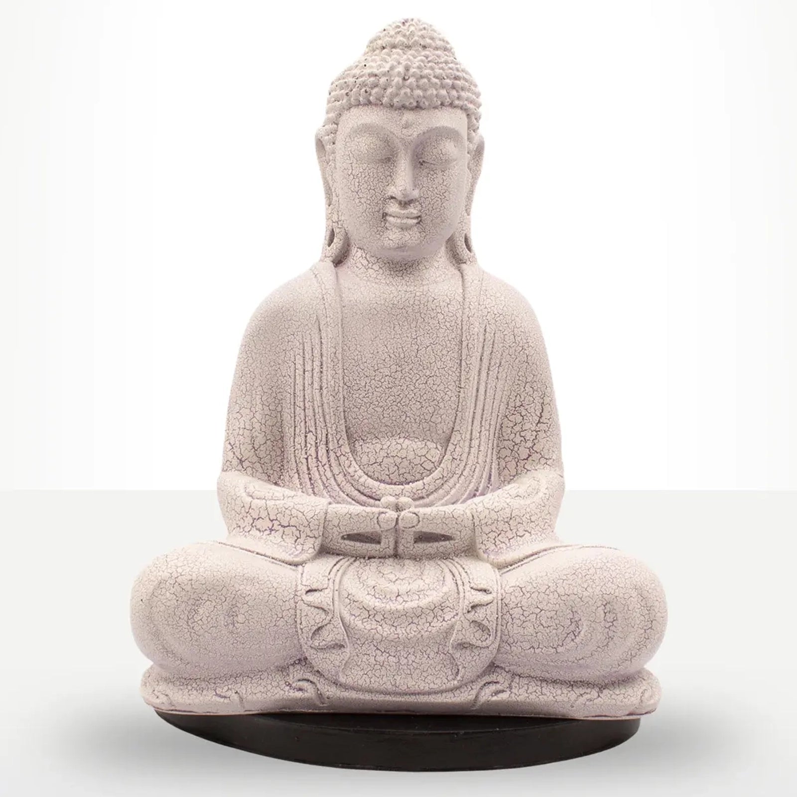 A seated Buddha statue in a light stone-like beige color with a textured, crackled finish, resting on a round black base against a white studio background.