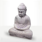 A seated Buddha statue in a light lavender-gray stone-like finish, shown against a plain white studio background.