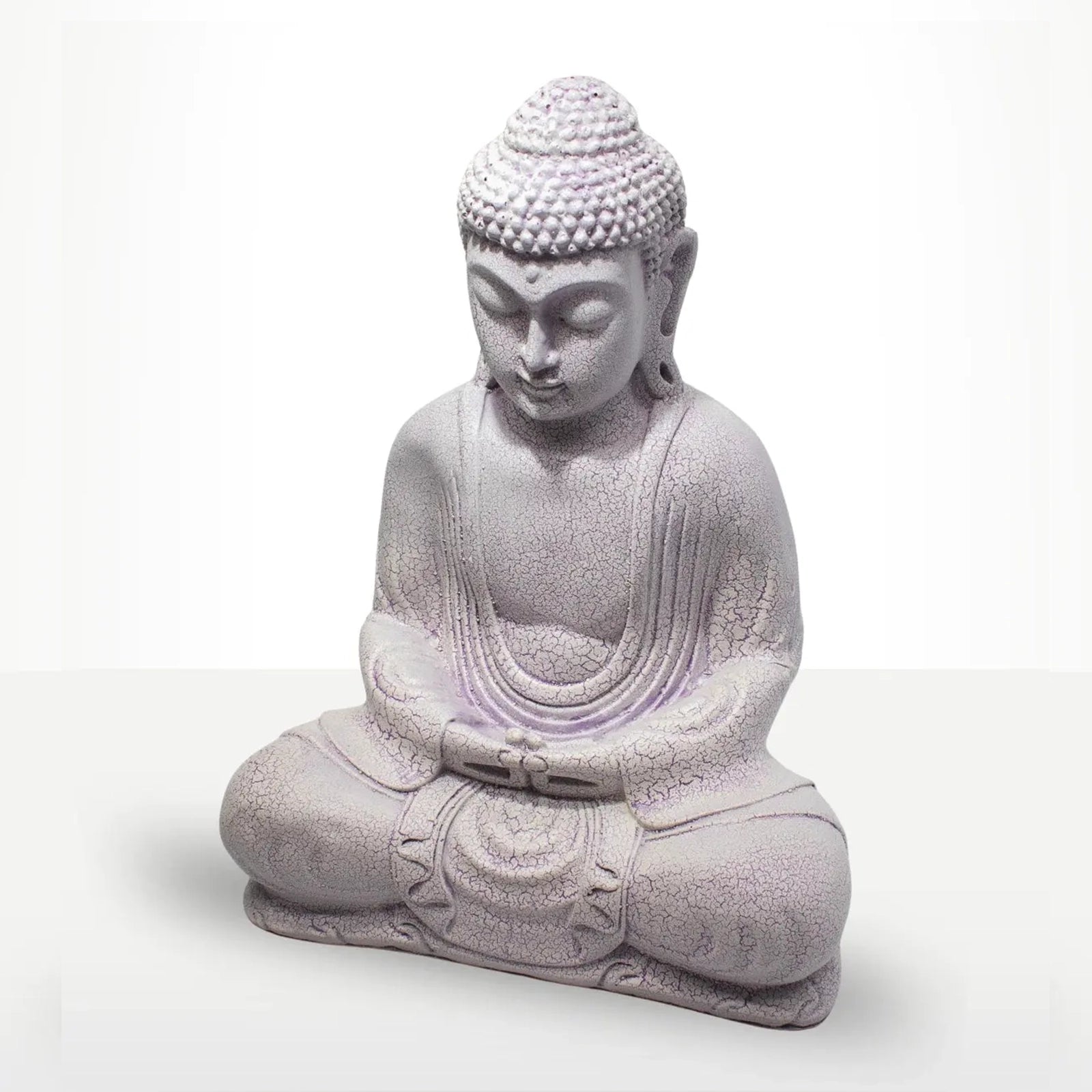 A seated Buddha statue in a light lavender-gray stone-like finish, shown against a plain white studio background.