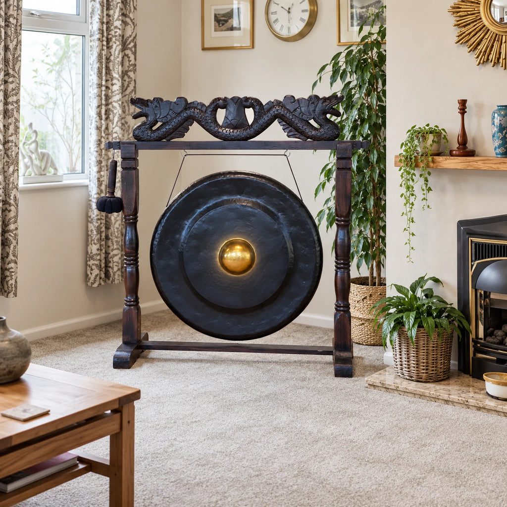 Large Healing Gong in Antique Dragon Stand, 80cm, Black beside a fireplace in a British living room.