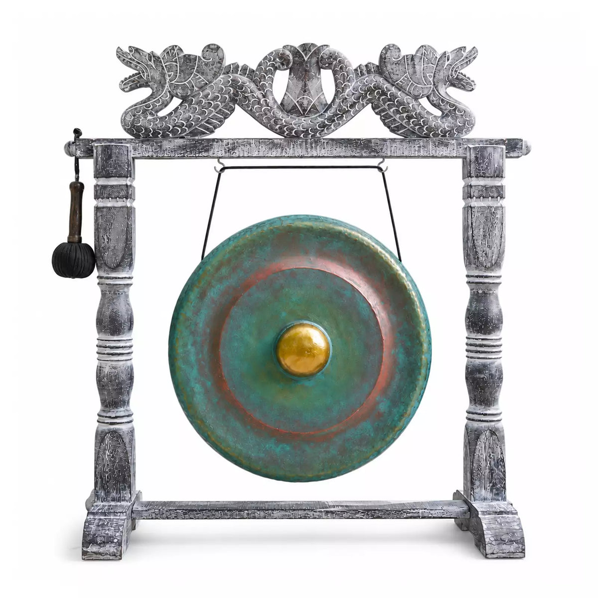 A decorative gong with a distressed gray wooden frame and a round green patinated metal drum head featuring a gold center, shown on a white background with a hanging mallet.