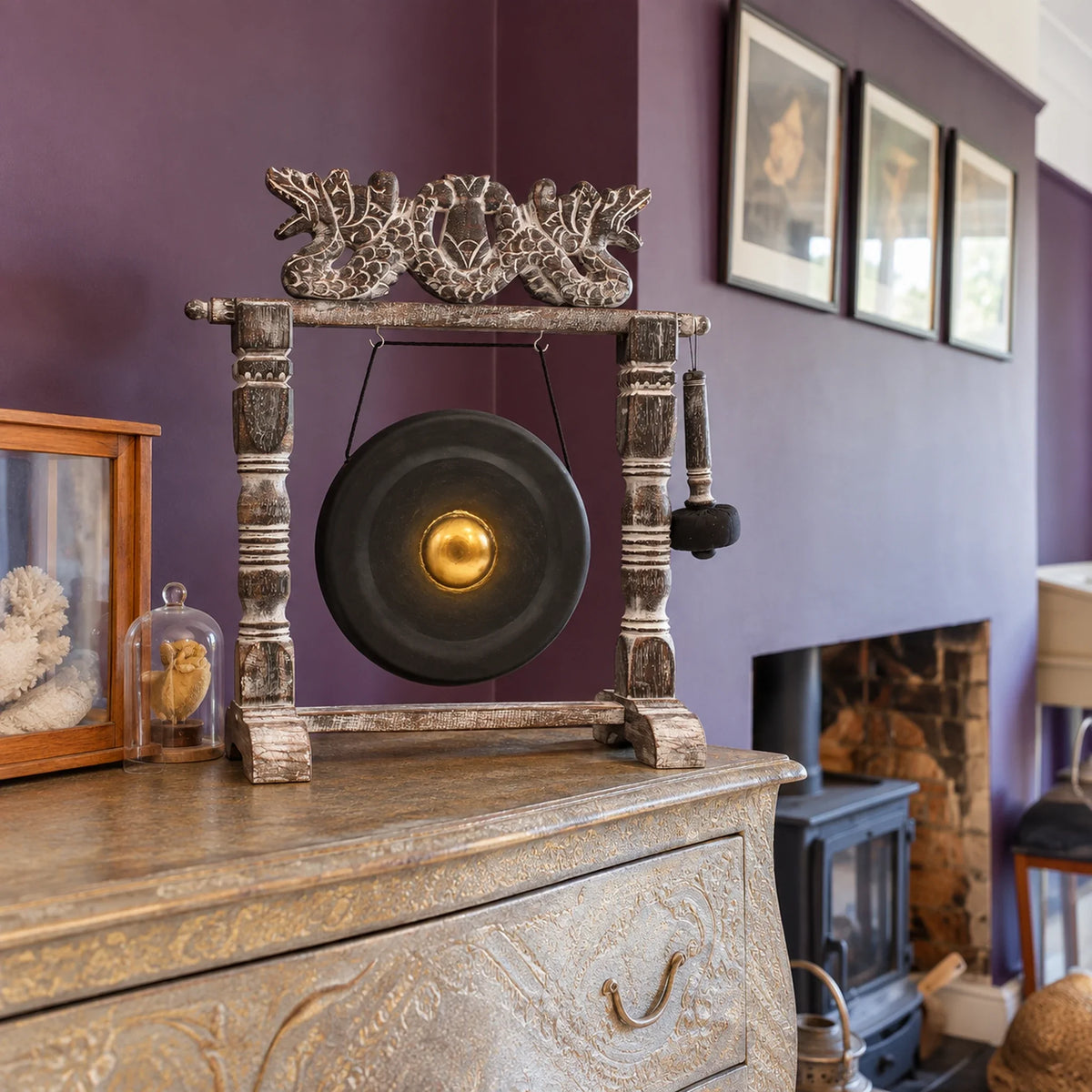 Small Healing Gong in Wooden Stand, 25cm, Black on a chest in a British sitting room.