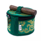 A green cylindrical fabric storage case with gold patterned embroidery, a black zipper, and a green elastic strap holding a wooden mallet on top. A small white tag reads 'MADE IN NEPAL'.
