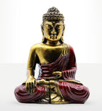 Red & Gold Buddha - Large showing a hand carved Buddha statue in gold and deep red, seated in a meditative lotus position with serene facial expression and detailed robes.