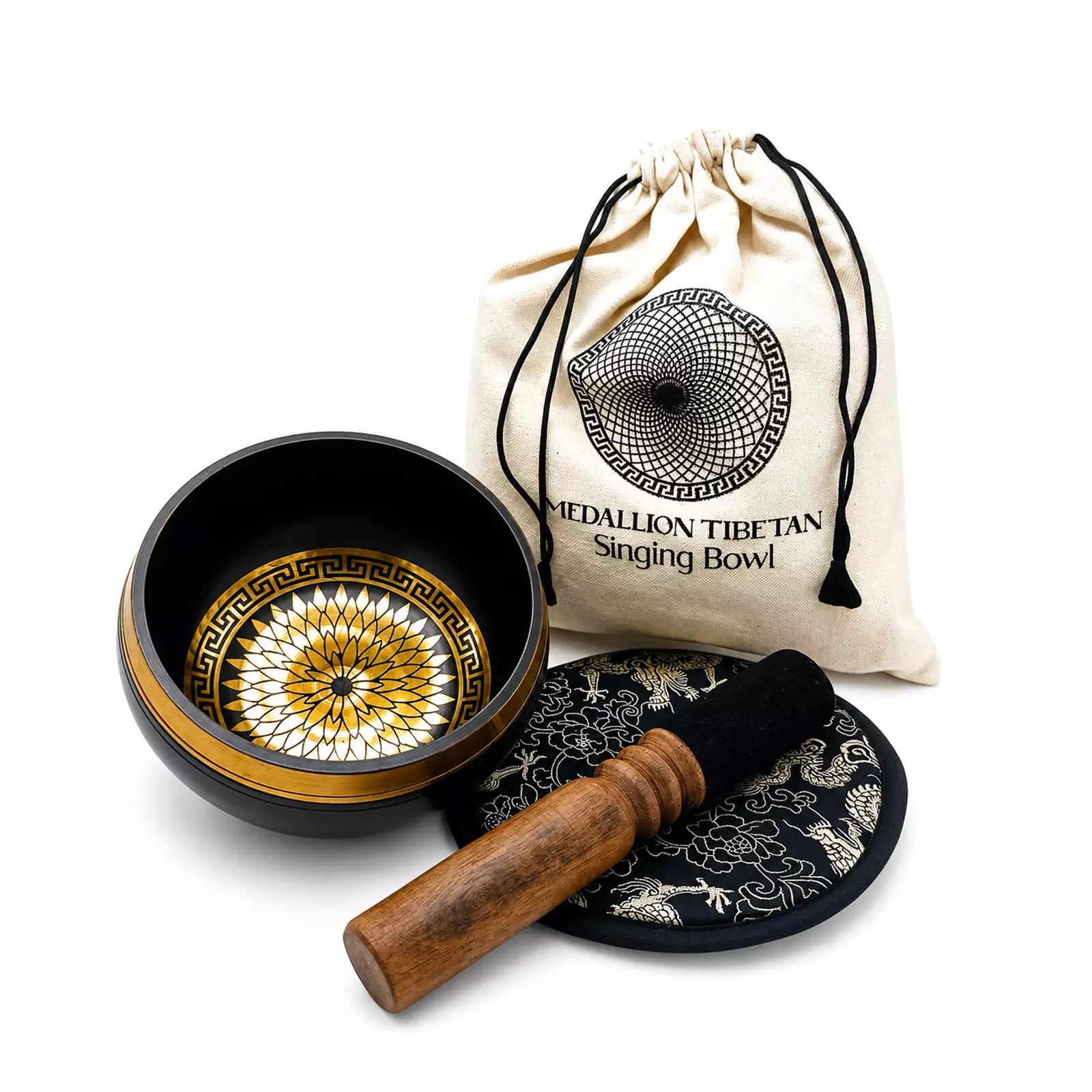A Tibetan singing bowl set on a white background, including a black singing bowl with a gold and white mandala pattern, a wooden mallet, a black and white decorative stand, and a cream-colored drawstring pouch labeled 'MEDALLION TIBETAN Singing Bowl'.