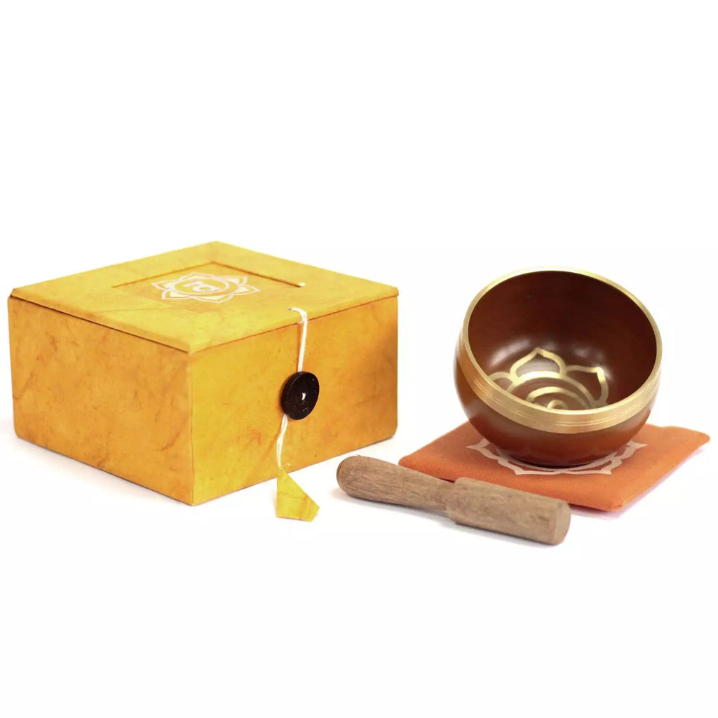 Tibetan singing bowl set with yellow box on a white background