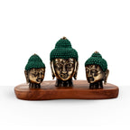 Set of 3 - Buddha Heads (asst sizes) displayed on a wooden base, featuring bronze-colored Buddha heads with textured green hair, perfect for serene Buddha decor and resin Buddha statues.