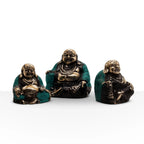 Set of 3 - Happy Buddha's (asst sizes) featuring hand-carved resin Buddha statues with a bronze finish and teal accents, ideal for Buddha decor and tabletop displays.