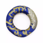Decorative wreath with blue and gold pattern on a white background