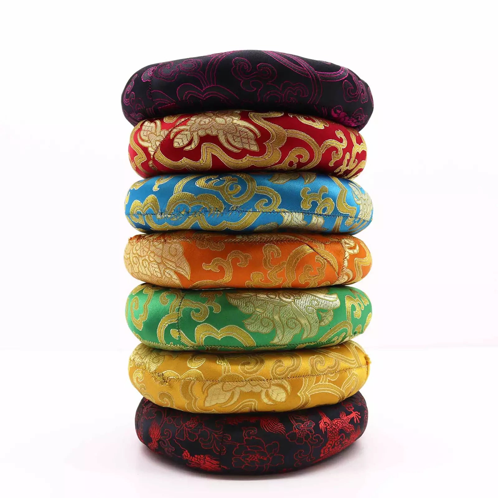 A stack of seven round woven fabric cushions or seat pads in different colors, each with a gold cloud-like brocade pattern, photographed on a white background.