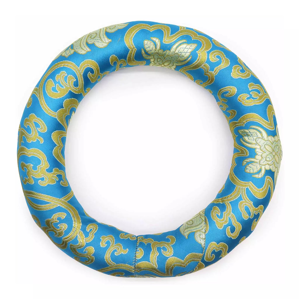 A circular ring-shaped product made of blue satin-like fabric with an ornate gold floral and scroll pattern, shown on a plain white background.