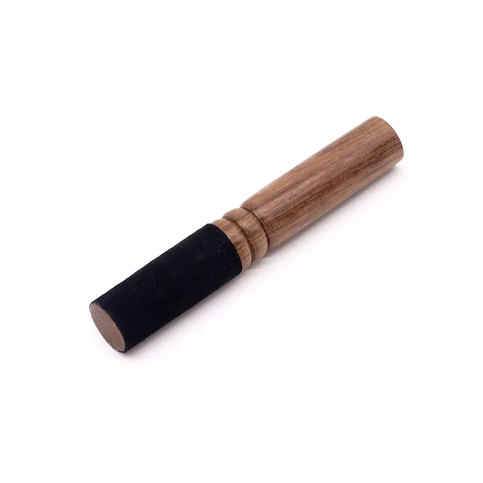 Wooden and black cylindrical object on a white background