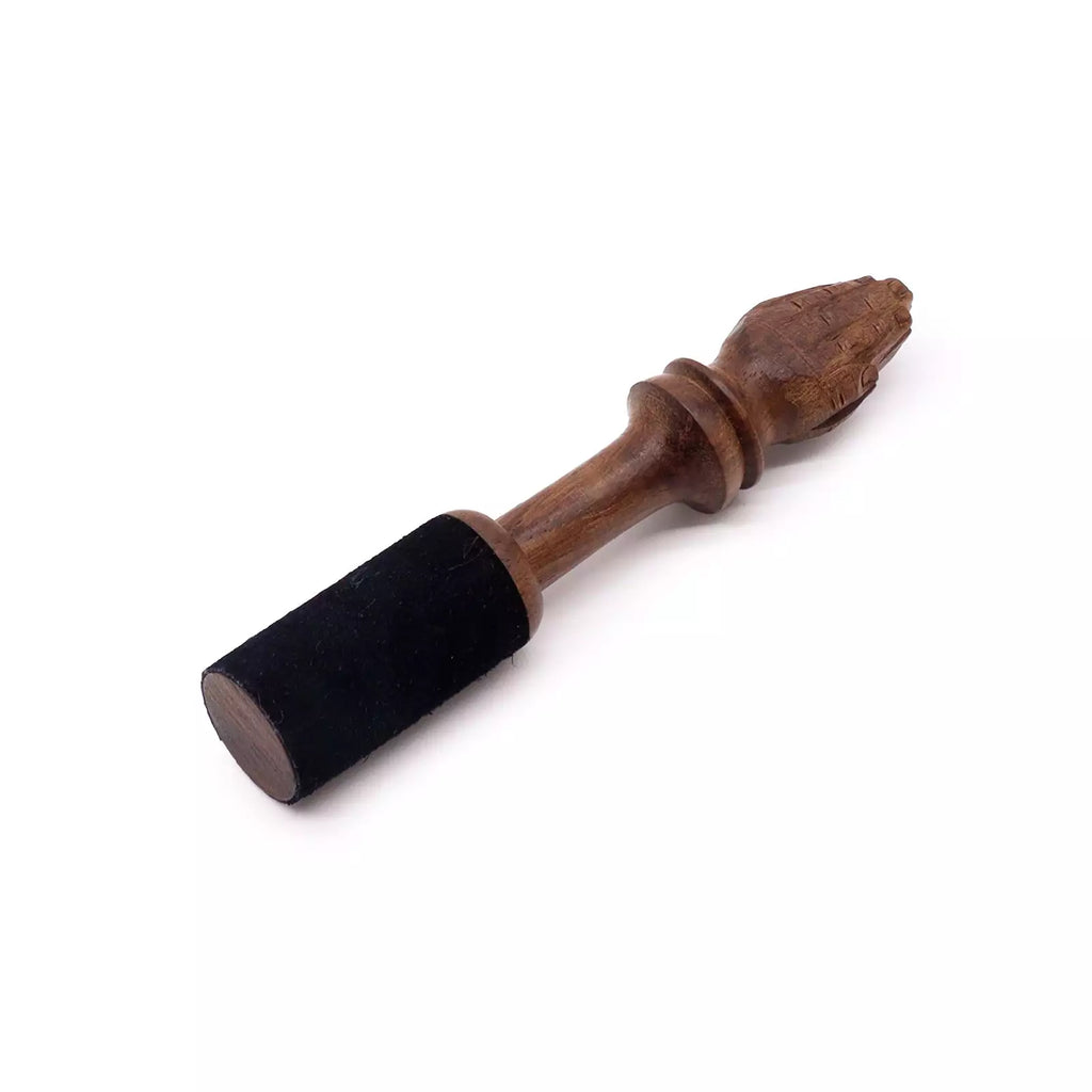 Wooden tool with black foam handle on a white background