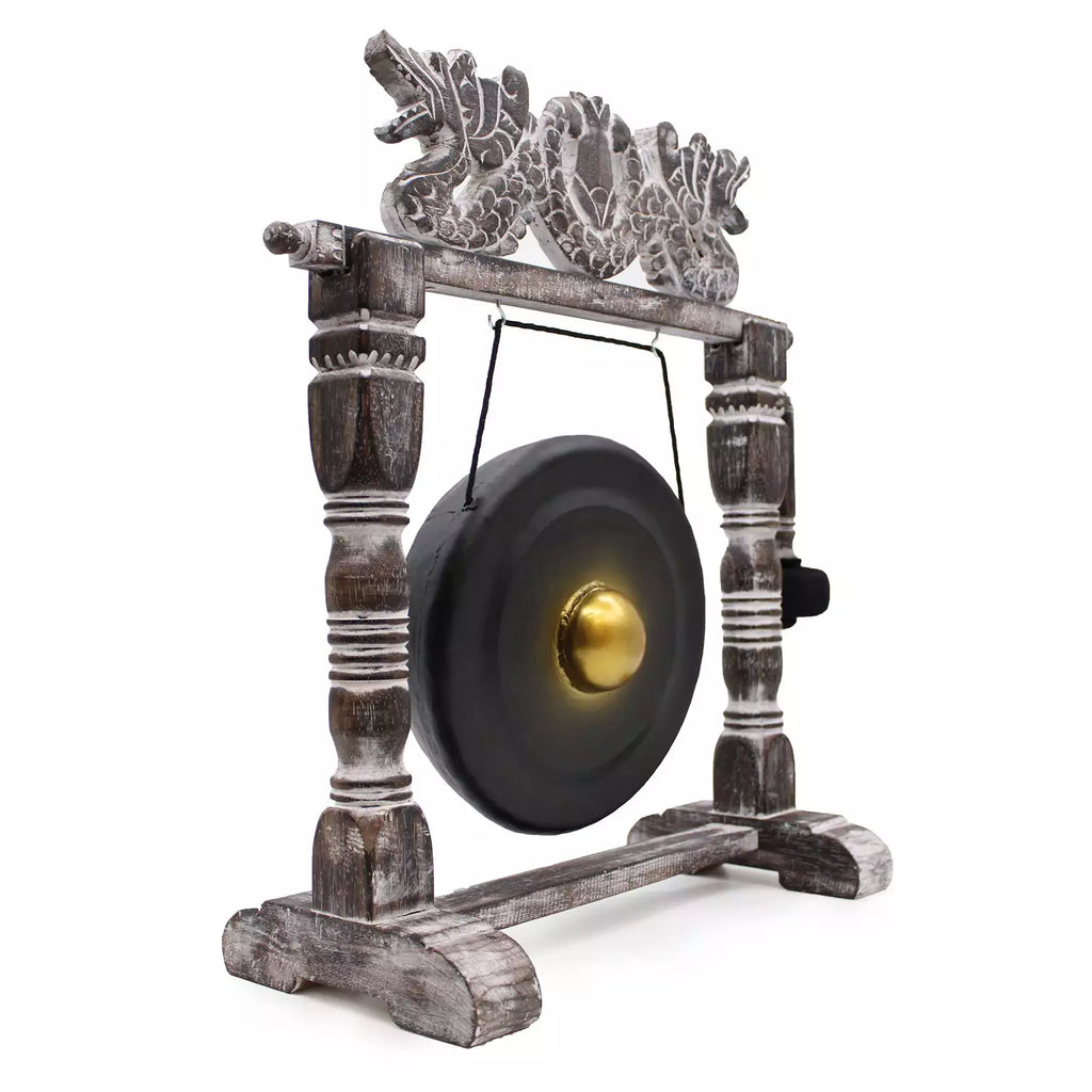 Decorative gong with wooden arch and dragon design on a white background