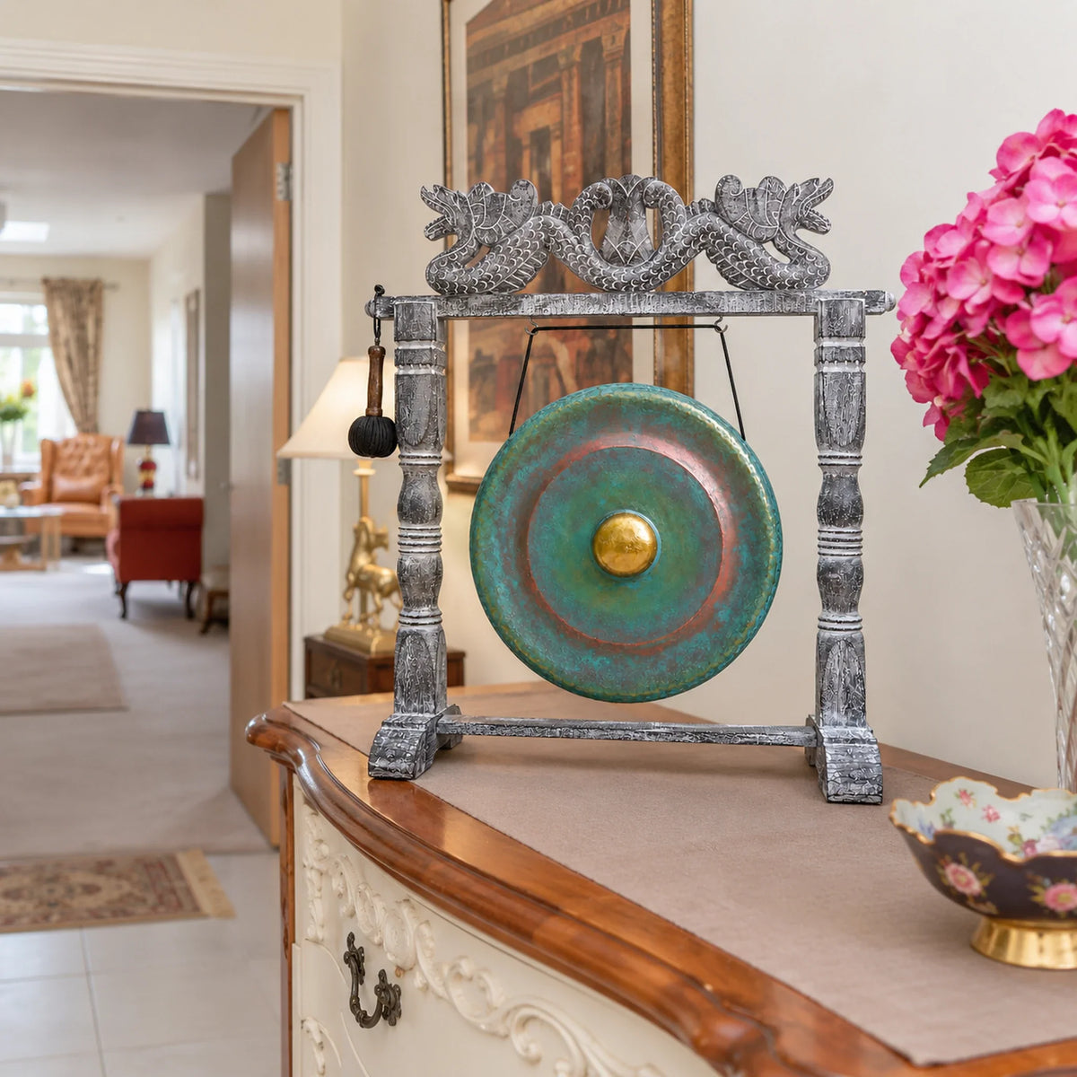 Medium Healing Gong in Wooden Stand, 35cm, Greenwash on a cabinet in a British hallway.