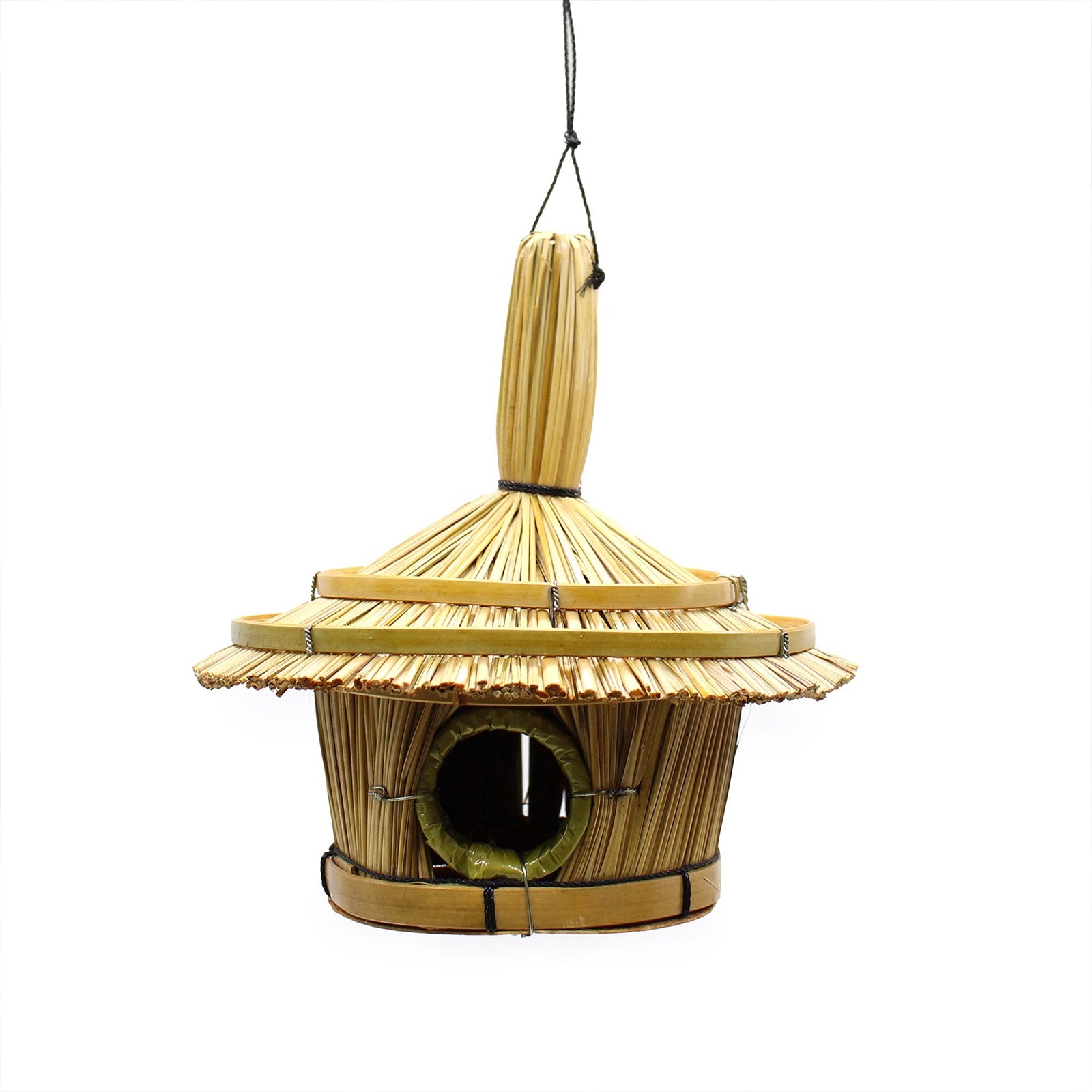Small Round Seagrass Bird Box 17x17cm hanging from a tree branch in a garden setting, showcasing natural woven seagrass texture and round entrance hole.