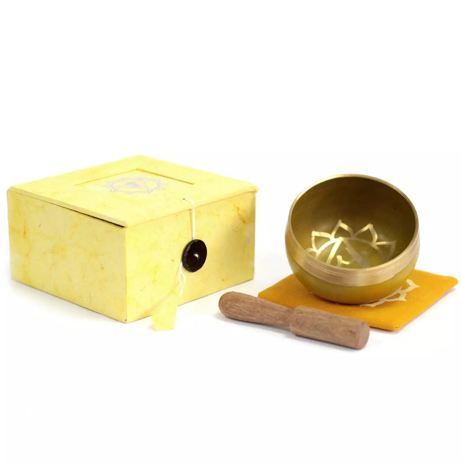 Gold singing bowl set with yellow box and wooden striker on a white background