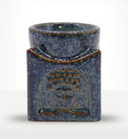 Square Buddha Burner - Dusty Blue featuring a textured ceramic design with a serene Buddha face relief, ideal for use as a Buddha oil burner or decorative incense plate.