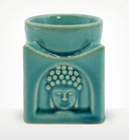 Square Buddha Burner - Soft Turquoise featuring a smooth ceramic finish with a subtle Buddha face relief, designed as a peaceful incense or oil burner for calming home decor.