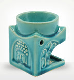 Square Buddha Burner - Soft Turquoise ceramic oil burner with a carved Buddha face and decorative wave pattern, designed for calming and meditative decor.