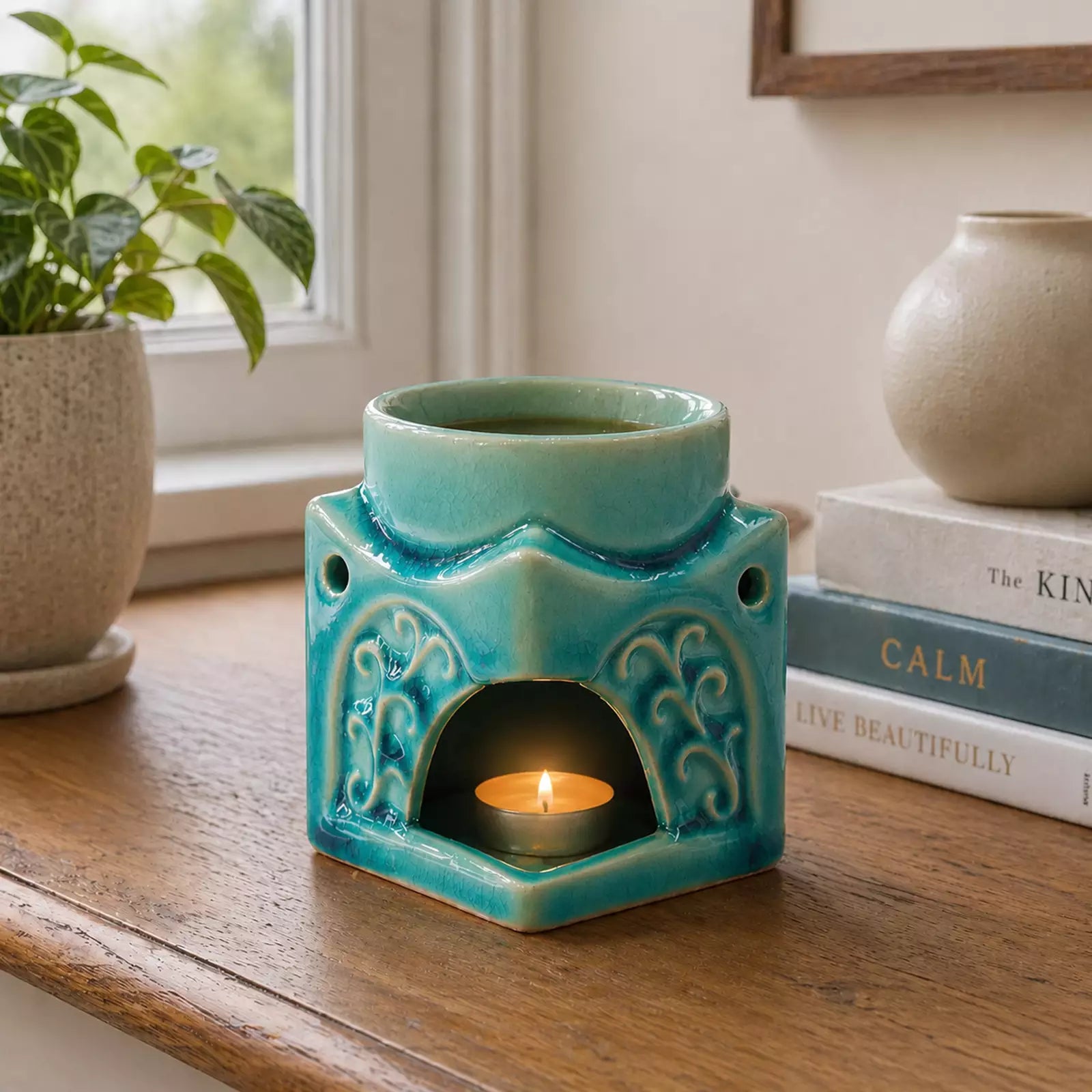 Square Buddha Burner - Soft Turquoise ceramic incense burner with intricate design, lit tealight candle inside, releasing smoke from cone incense in a calm home setting.