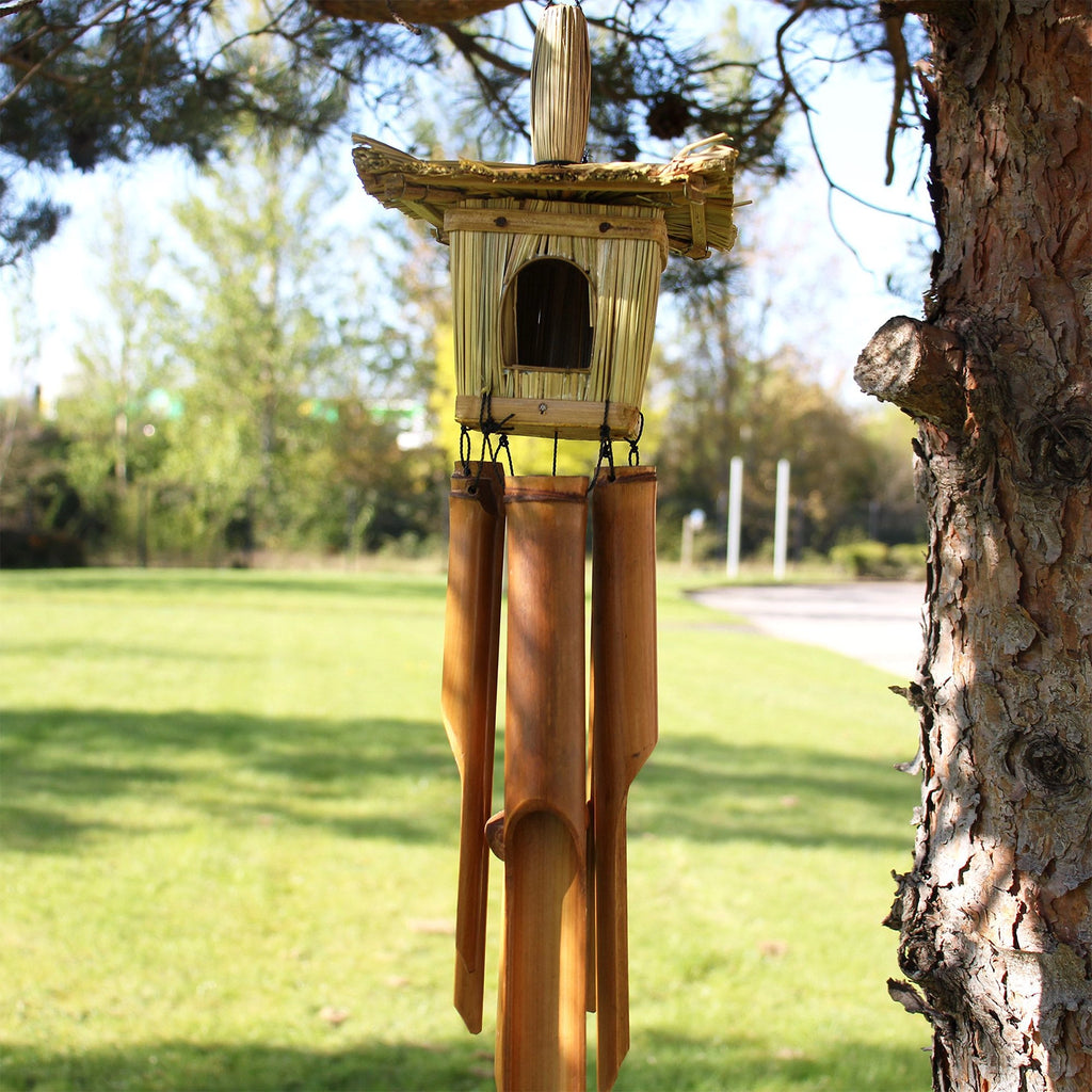 Square Seagrass Bird Box with Chimes 49x15cm featuring a natural woven seagrass birdhouse above bamboo wind chimes, designed for decorative outdoor or indoor use.
