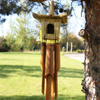 Square Seagrass Bird Box with Chimes 49x15cm featuring a natural woven seagrass birdhouse above bamboo wind chimes, designed for decorative outdoor or indoor use.