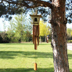 Square Seagrass Bird Box with Chimes 49x15cm featuring a natural woven seagrass birdhouse above bamboo wind chimes, designed for decorative outdoor or indoor use.