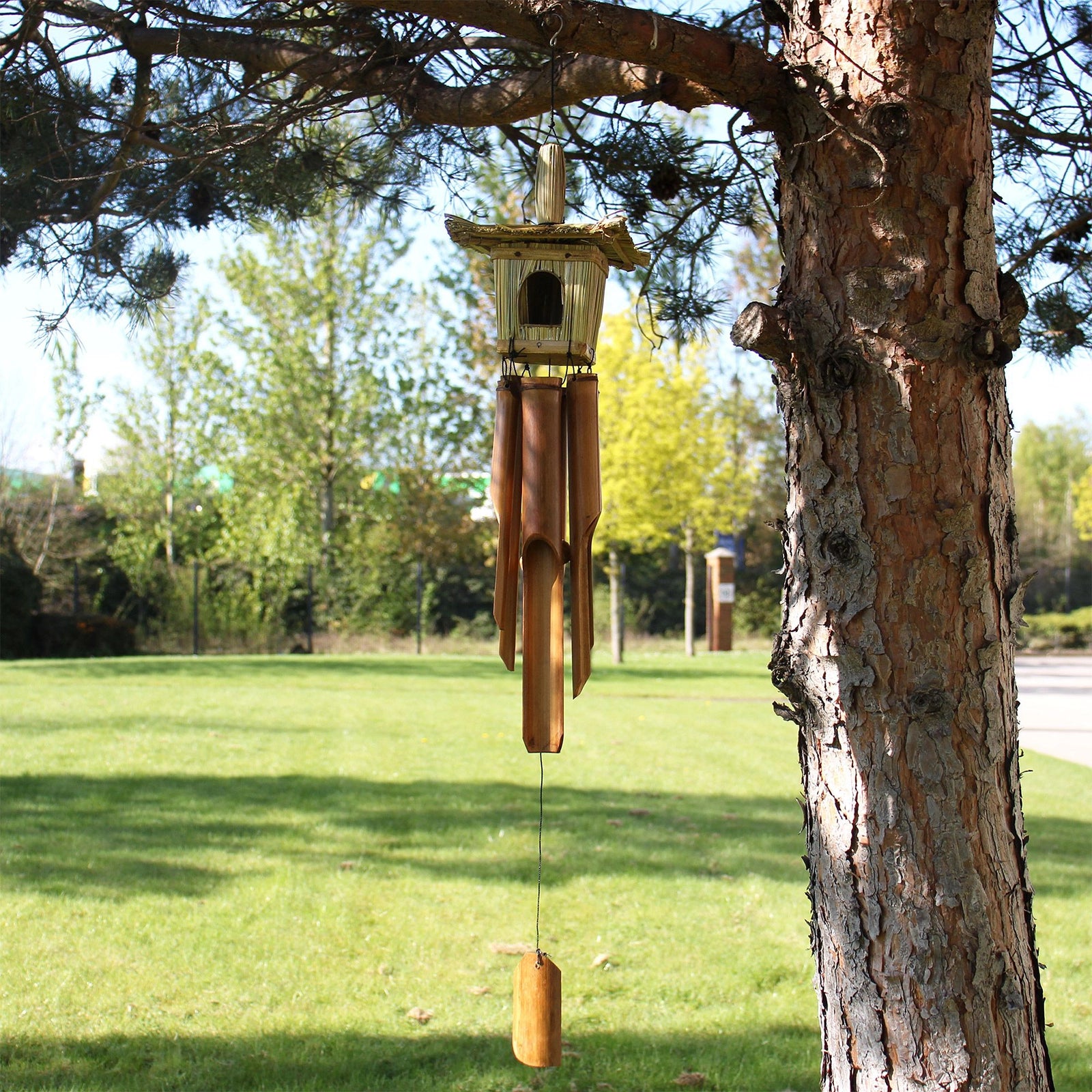 Square Seagrass Bird Box with Chimes 49x15cm featuring a natural woven seagrass birdhouse above bamboo wind chimes, designed for decorative outdoor or indoor use.