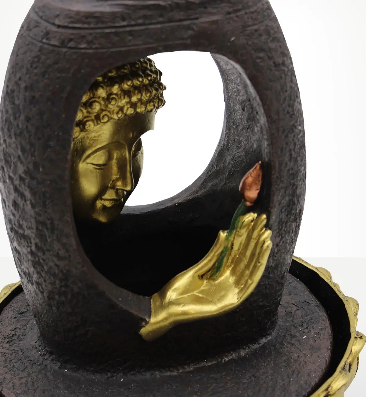 Tabletop Water Feature - 30cm - Golden Buddha & Vitarka Mudra showing a detailed golden Buddha face and hand in Vitarka Mudra holding a small flower, set within a textured dark structure.