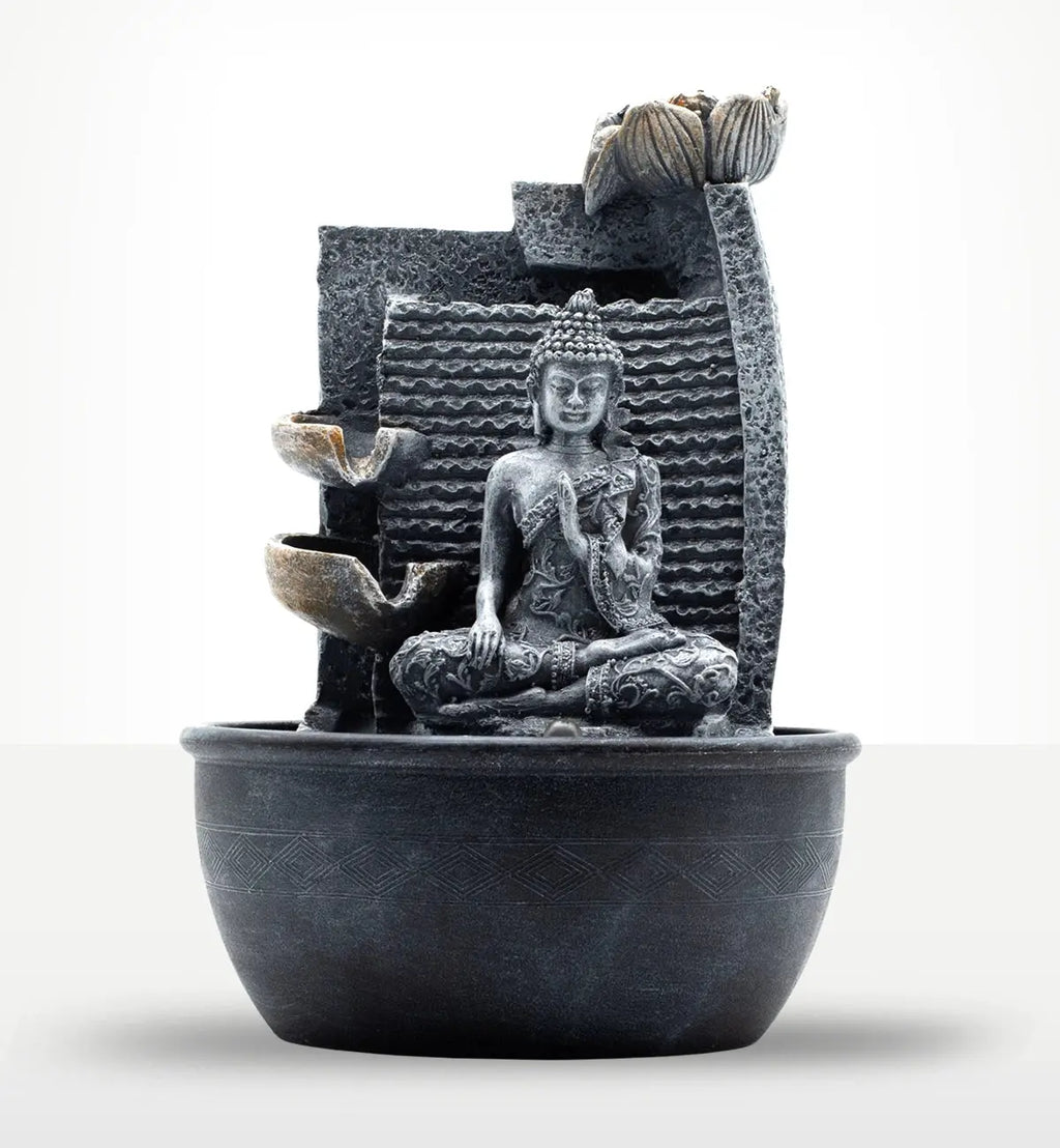 Tabletop Water Feature - 19x19x28cm - Buddha, Lotus Flower Cascading Potsx featuring a serene resin Buddha statue seated in meditation with cascading lotus flower pots and textured backdrop.