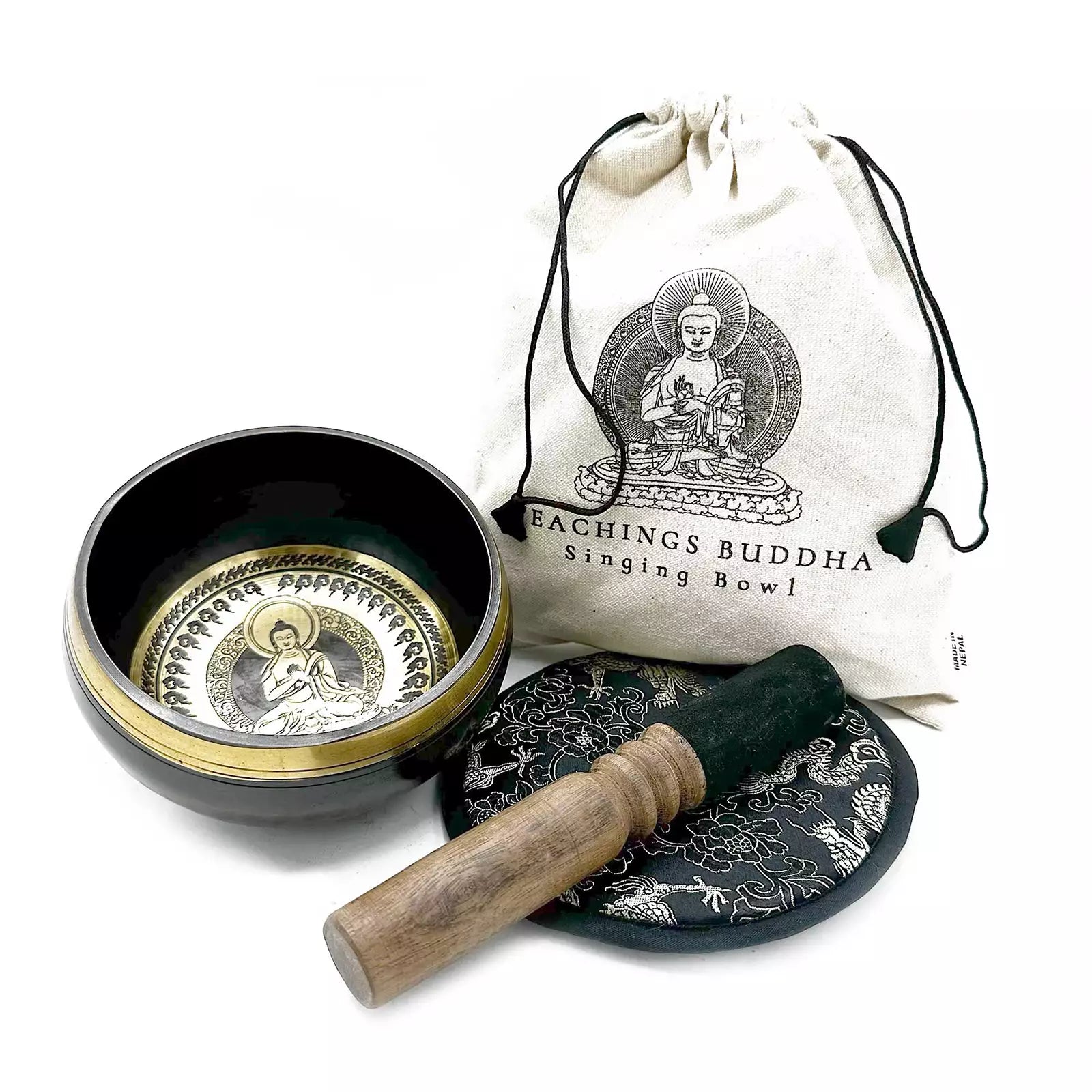 Singing bowl set with a bag labeled 'Teachings Buddha' on a white background