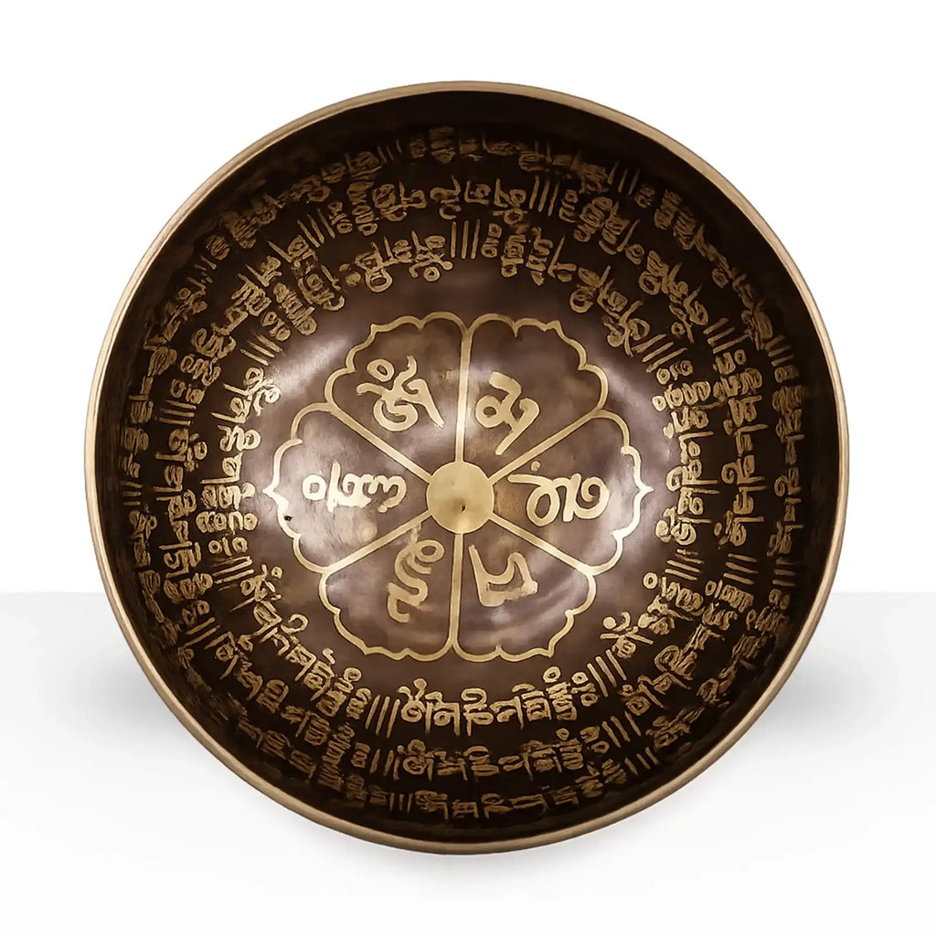 Tibetan Healing Engraved Bowl - 16cm - Mantra featuring intricate golden inscriptions and sacred symbols inside a polished bronze-colored metal bowl for meditation and spiritual practices.