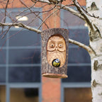 Tree Trunk Face - Bird House - Wise Owl features a hand-carved owl design on natural wood, combining rustic charm with functional birdhouse craftsmanship.
