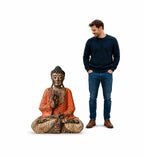 Vintage Orange Hand Carved Buddha Wooden Statue - 40cm - Teaching Transmission displayed next to a man for size reference, showcasing its intricate detailing and vibrant color.