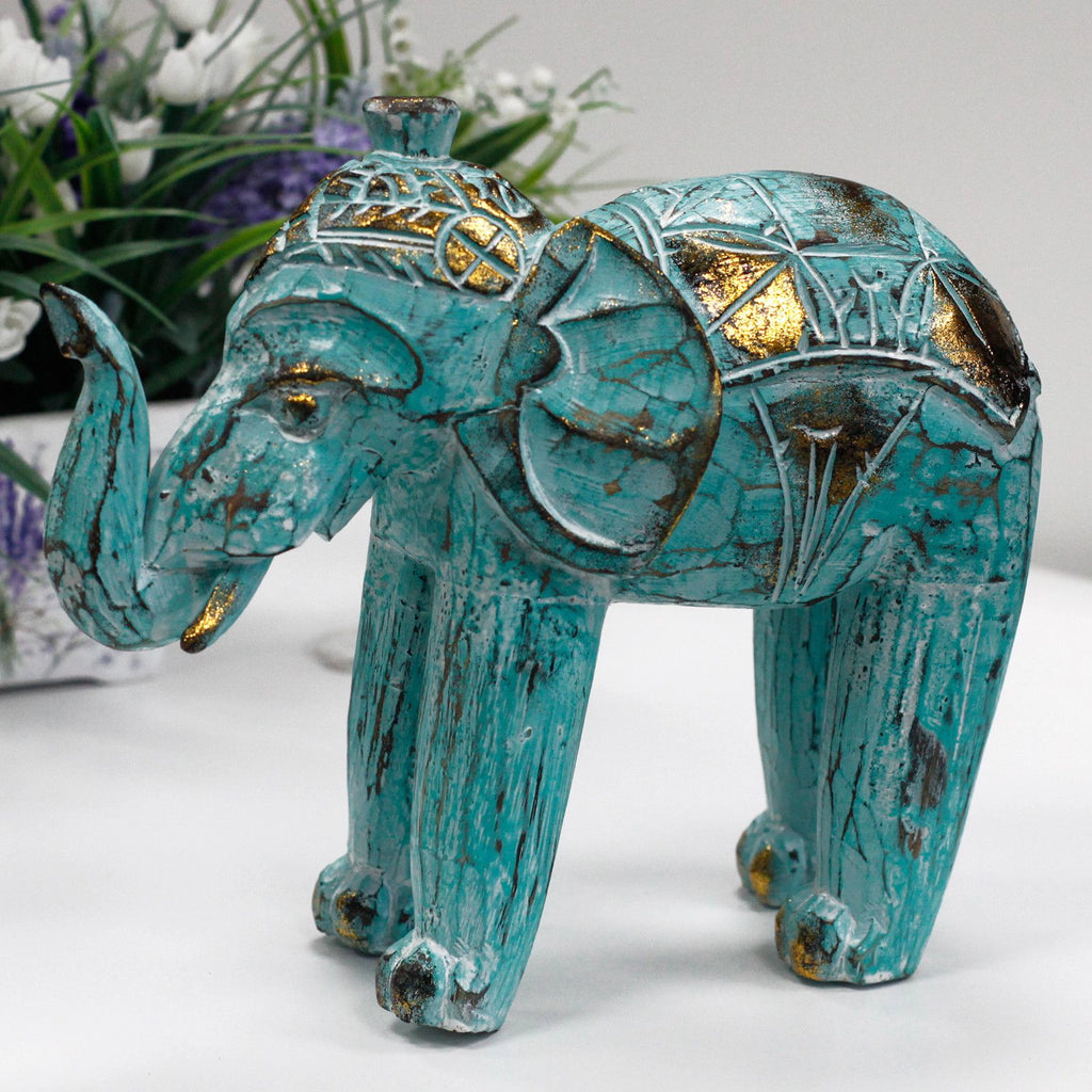Wood Carved Elephant - Turquoise Gold featuring intricate hand-carved details with turquoise and gold accents, showcasing a beautifully textured decorative elephant figurine.