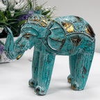 Wood Carved Elephant - Turquoise Gold featuring intricate hand-carved details with turquoise and gold accents, showcasing a beautifully textured decorative elephant figurine.
