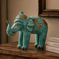 Wood Carved Elephant - Turquoise Gold featuring intricate hand-carved details with turquoise and gold accents, showcasing a beautifully textured decorative elephant figurine.