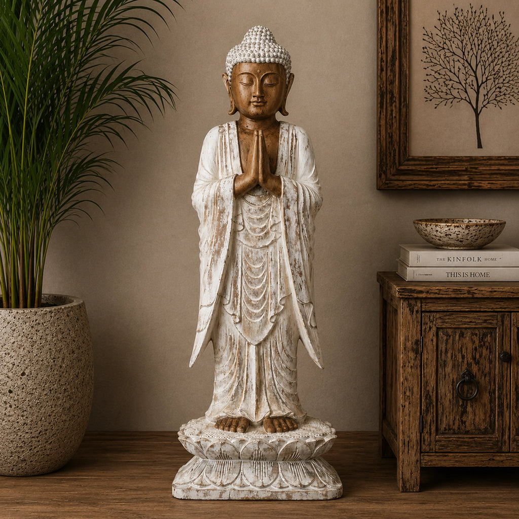 Wooden Buddha Statue Standing - Whitewash - 1m Welcome featuring a hand-carved design with serene expression and prayer hands, displayed as elegant Buddha decor in a calming room setting.