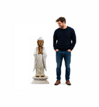 Man standing next to a Wooden Buddha Statue Standing - Whitewash - 1m Welcome, a hand-carved decorative Buddha statue with intricate details and a serene expression.