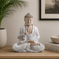 Wooden Buddha Statue Whitewash - 30cm Teaching Transmission sitting in meditation pose on a wooden surface with calm neutral decor background.
