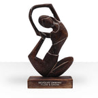 Wooden Yoga Lady - Antique - Revolved Pose - "Revolve Unwind - Flow & Grow" hand-carved wooden sculpture of a woman in a graceful, flowing yoga pose on a wooden base.