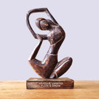 Wooden Yoga Lady - Antique - Revolved Pose - "Revolve Unwind - Flow & Grow" hand-carved wooden sculpture of a woman in a graceful, flowing yoga pose on a wooden base.