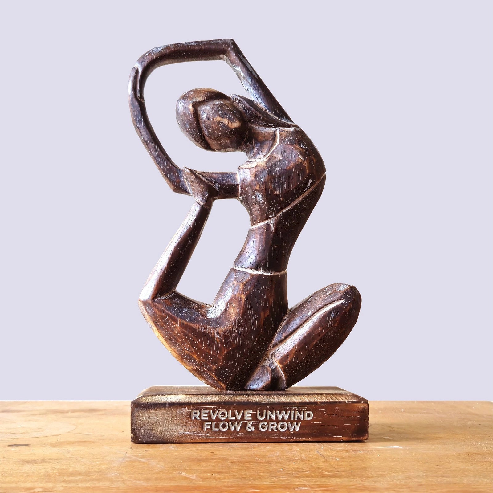 Wooden Yoga Lady - Antique - Revolved Pose - "Revolve Unwind - Flow & Grow" hand-carved wooden sculpture of a woman in a graceful, flowing yoga pose on a wooden base.