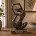 Wooden Yoga Lady - Antique - Revolved Pose - "Revolve Unwind - Flow & Grow" hand-carved wooden sculpture of a woman in a graceful, flowing yoga pose on a wooden base.