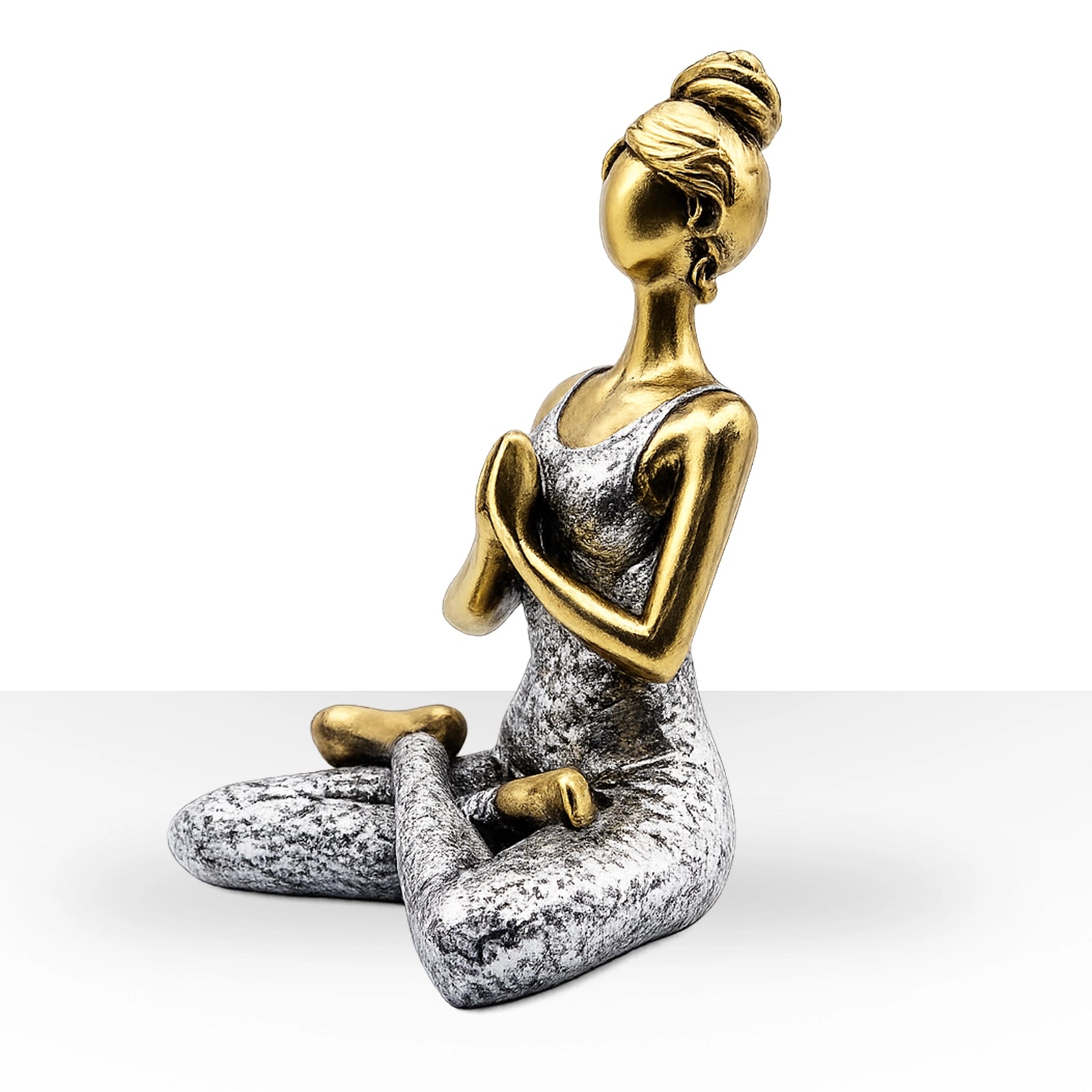 Yoga Lady Figure - Bronze & Silver 24cm depicts a serene woman in a seated meditation pose, blending bronze and silver tones for a calming decorative accent.