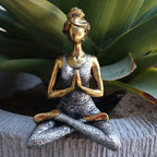 Yoga Lady Figure - Bronze & Silver 24cm depicts a serene woman in a seated meditation pose, blending bronze and silver tones for a calming decorative accent.